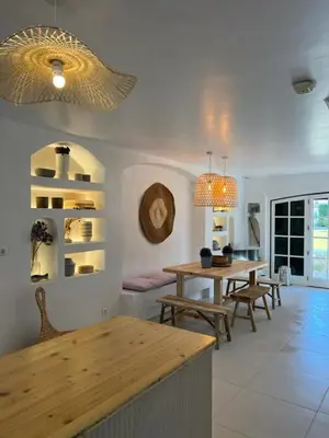 a living room with a table and a dining room at T3 Townhouse Old Village Vilamoura in Vilamoura