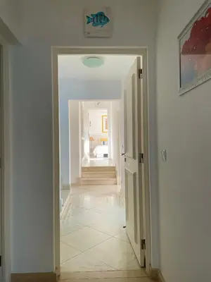 a hallway with a door leading into a room at Vila Marine in Albufeira