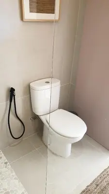 a bathroom with a white toilet in a room at T2 Apartment Old Village Vilamoura in Vilamoura