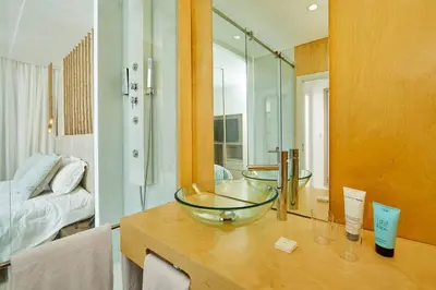 a bathroom with two glass bowls on a counter at Areias Senses in Albufeira