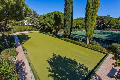 an overhead view of a green lawn with trees at Four Seasons Country Club in Quinta do Lago