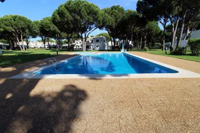 a shadow of a person standing next to a swimming pool at Vilamouratenis 'Blue' by SAPvillas in Vilamoura