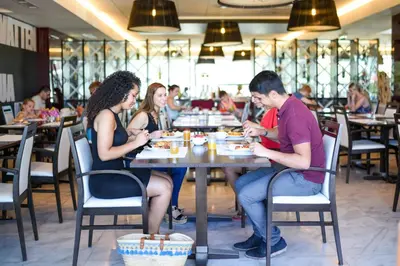 a group of different drinks in wine glasses on a table at Aquashow Park Hotel in Quarteira