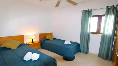 a bedroom with two beds and a window at Terraços do Mar 46- Clever Details in Vilamoura