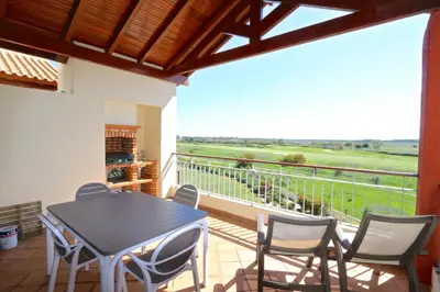 a dining room with a table and chairs on a balcony at Golf Mar Village - Clever Details in Vilamoura