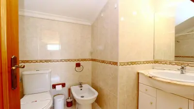 a bathroom with a toilet and a sink at Falésia Marina - Clever Details in Vilamoura