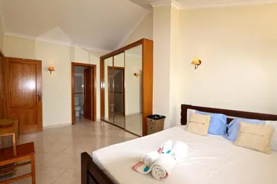 a bedroom with a bed with towels on it at Falésia Marina - Clever Details in Vilamoura