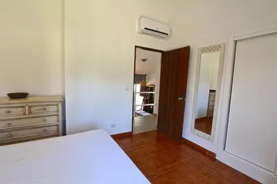 a bedroom with a bed and a dresser and a mirror at Marina Parque - Clever Details in Vilamoura