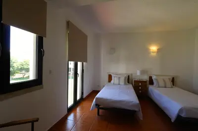 a hotel room with two beds and a window at Marina Parque - Clever Details in Vilamoura