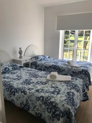 two beds sitting next to each other in a bedroom at Old Village in Vilamoura