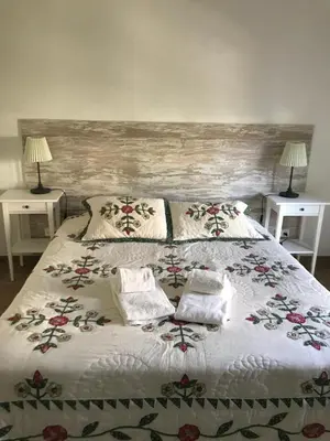 a bedroom with a large bed with two night stands at Old Village in Vilamoura