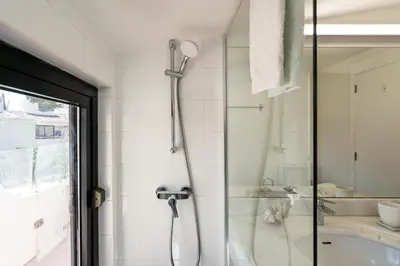 a bathroom with a shower and a sink at BmyGuest - Quinta do Lago Terrace Apartment II in Quinta do Lago