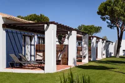 a pergola on a house with a lawn at Pestana Vila Sol - Vilamoura Premium Golf Resort in Vilamoura