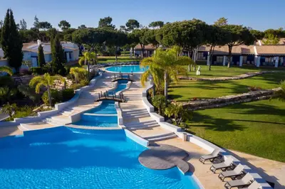 an aerial view of a pool at a resort at Pestana Vila Sol - Vilamoura Premium Golf Resort in Vilamoura