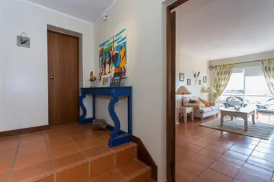 a living room with a blue fireplace in a room at Marina de Vilamoura Apart in Vilamoura
