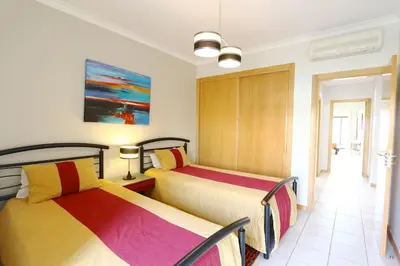 a bedroom with two beds in a room at Terraços de Vilamoura 55- Clever Details in Vilamoura