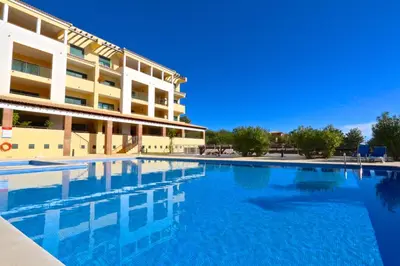 a large swimming pool in front of a building at Terraços de Vilamoura 55- Clever Details in Vilamoura