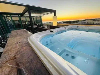 a hot tub sitting on top of a building at Marina Vilamoura Penthouse Aquamar 606 in Vilamoura