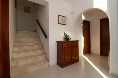 a hallway with stairs and an entry way at Villa Gonçalves in Albufeira