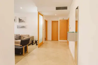 a living room with a couch and a table at Marina Vilamoura - Aquamar 215 - VilamouraSun in Vilamoura