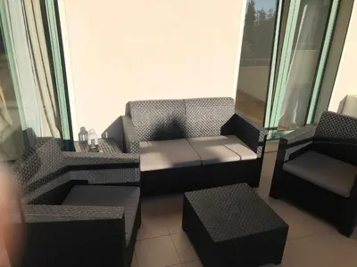 a living room with a couch and a chair at Marina Vilamoura - Aquamar 012 - by VilamouraSun in Vilamoura