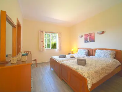 a bedroom with a large bed and a window at Holiday Home Montinho by Interhome in Loulé