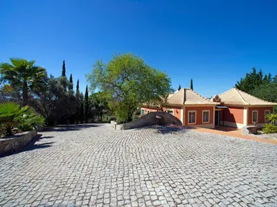 a brick driveway in front of a house at Holiday Home Montinho by Interhome in Loulé