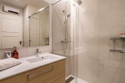 a bathroom with a sink and a shower at Solar do Golfe apt 101 - By Vilamoura Sun in Vilamoura