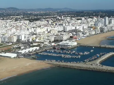 an aerial view of a harbor with boats in the water at VILAMOURA FÉRIAS by Ethnic Ocean in Vilamoura