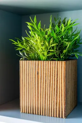 a wooden planter with a green plant in it at Vilamoura Garden House - Golf & Beach in Vilamoura
