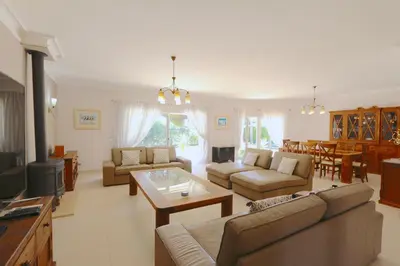 a living room with a couch and a table at Villa Corvo 123- Clever Details in Vilamoura