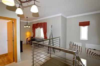 a staircase in a house with a stair case at Villa Corvo 123- Clever Details in Vilamoura