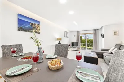 a dining room with a table with wine glasses at Garden Hill Relax & Old Town by OCvillas in Albufeira