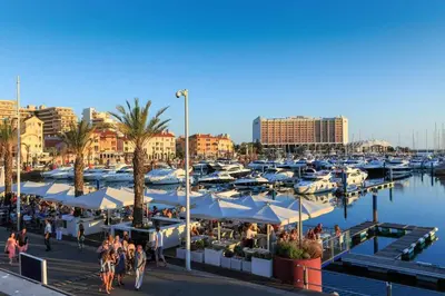 a marina with manyocked boats and people walking around at Marina Vilamoura Aquamar 504 by VilamouraSun in Vilamoura