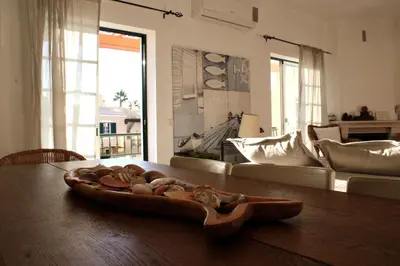 a tray of food on a table in a living room at Encosta das Oliveiras 49D in Vilamoura