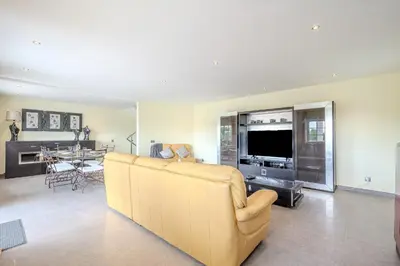 a living room with a couch and a television at Villa Monica - POOL HEATED - By Algarkasa in Albufeira