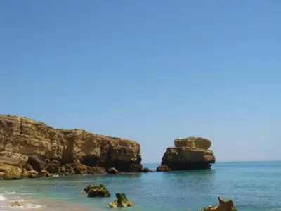 a view of a beach with rocks in the water at Villa Amendoeira-POOL HEATED - By Algarkasa in Guia