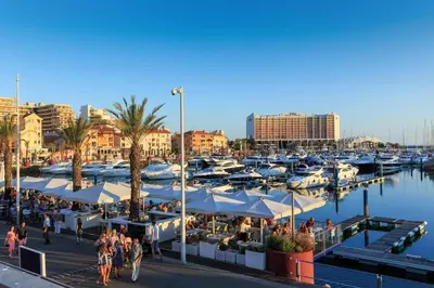 a marina with manyocked boats and people walking around at Marina Vilamoura - Aquamar 112 - By Vilamoura Sun in Vilamoura