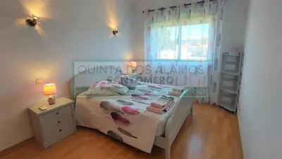 a small bedroom with a bed and a window at Apartamento AH in Guia