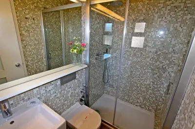 a bathroom with a shower and a sink and a toilet at Marina Parque 83 - Clever Details in Vilamoura