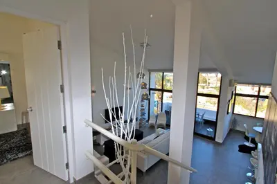 a living room with a couch and a table and chairs at Marina Parque 83 - Clever Details in Vilamoura