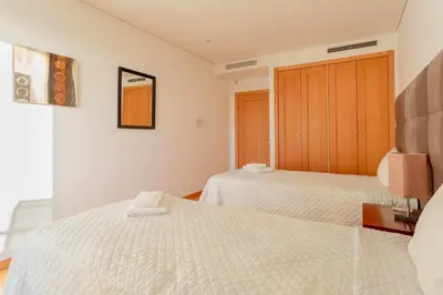 a kitchen with white cabinets and a counter top at Marina Vilamoura - Aquamar 309 By Vilamoura Sun in Vilamoura