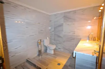 a bathroom with a toilet and a sink at Villa Heloise 139 - Clever Details in Vilamoura