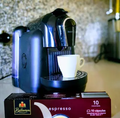 a coffee maker and a cup on a table at Algarve 
