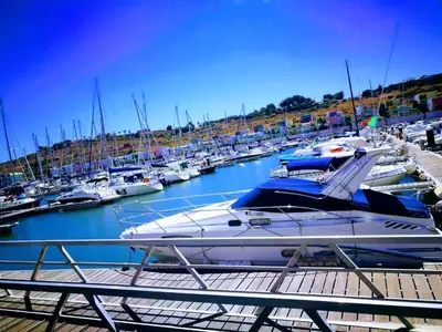 a boat docked at a marina with other boats at Algarve 