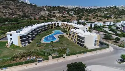 an aerial view of a building with a swimming pool at Algarve 