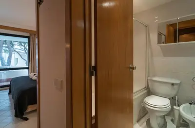 a bathroom with a toilet and a sink at BmyGuest - Quinta do Lago Lounge Apartment in Almancil