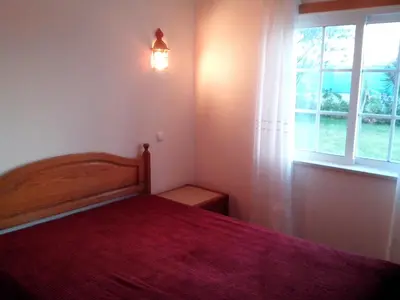 a bedroom with a bed and a window at Albufeira 2 bedroom apartment 5 min from Falesia beach and close to center B in Albufeira