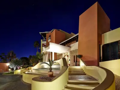 a villa with a staircase leading to a building at night at Four Seasons Vilamoura in Vilamoura