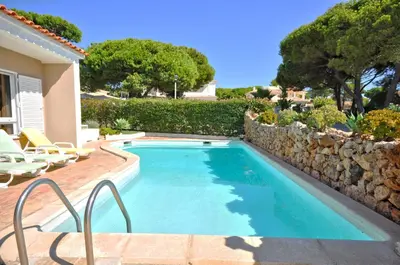 a bathroom with a toilet and a sink and a shower at Stylish and well-equipped, private pool, close to amenities, free AC Wifi in Quarteira